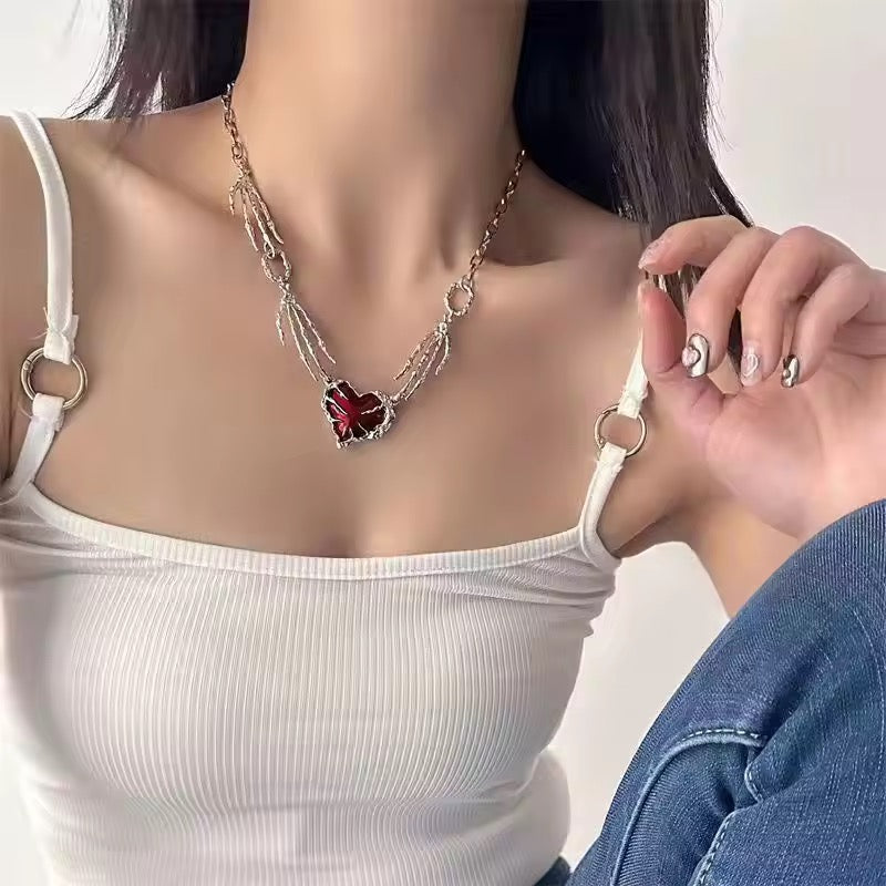 skull claw heart necklace