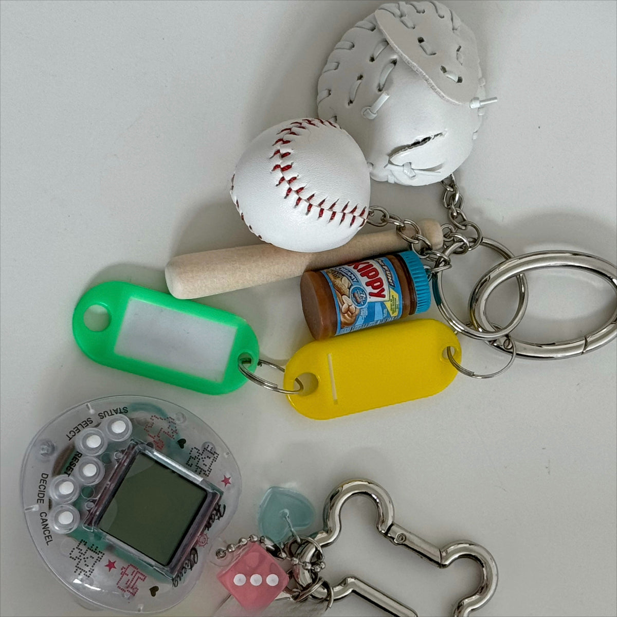tamagotchi pink and white keychains