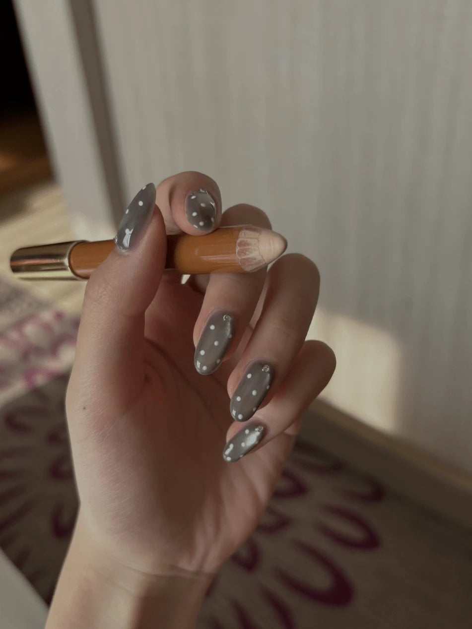 grey polka dot cat eye nails
