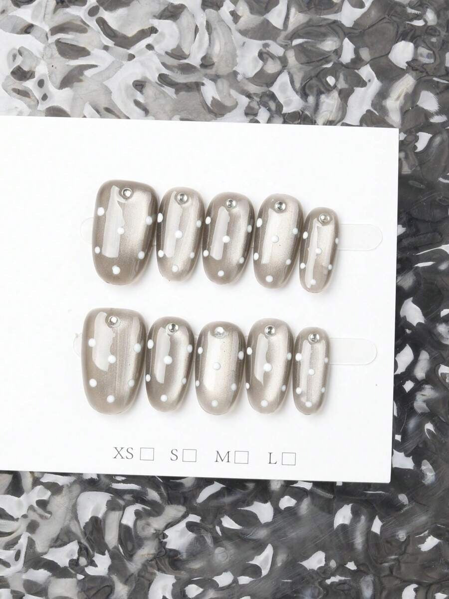 grey polka dot cat eye nails