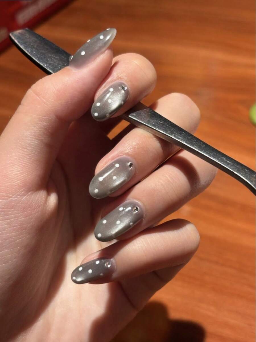 grey polka dot cat eye nails