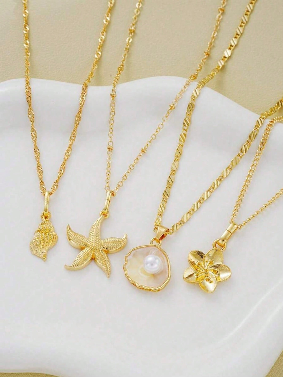 gold sea themed layered necklace set