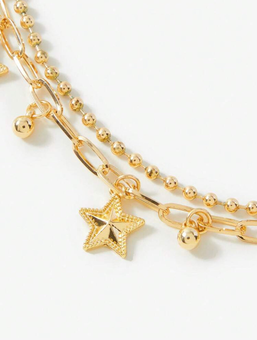 multi layered gold star bracelet