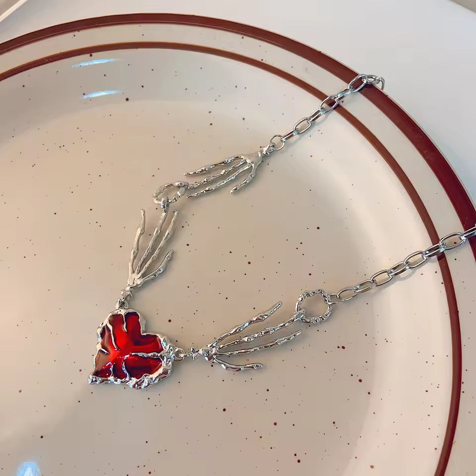 skull claw heart necklace