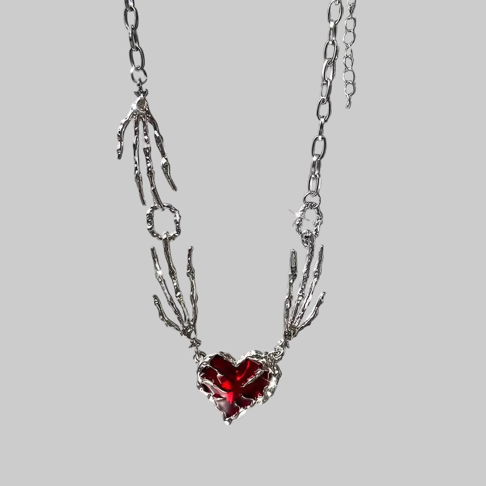 skull claw heart necklace