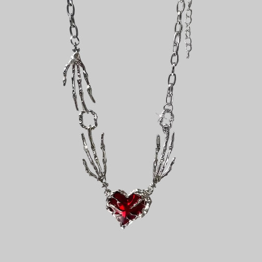 skull claw heart necklace