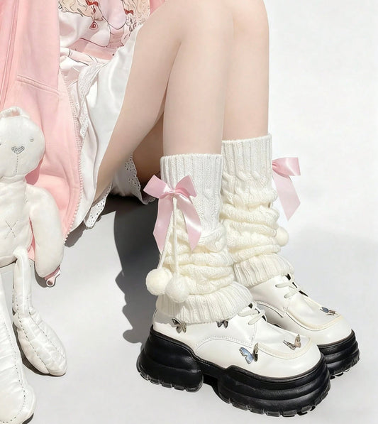 white flared leg warmers with pink bows