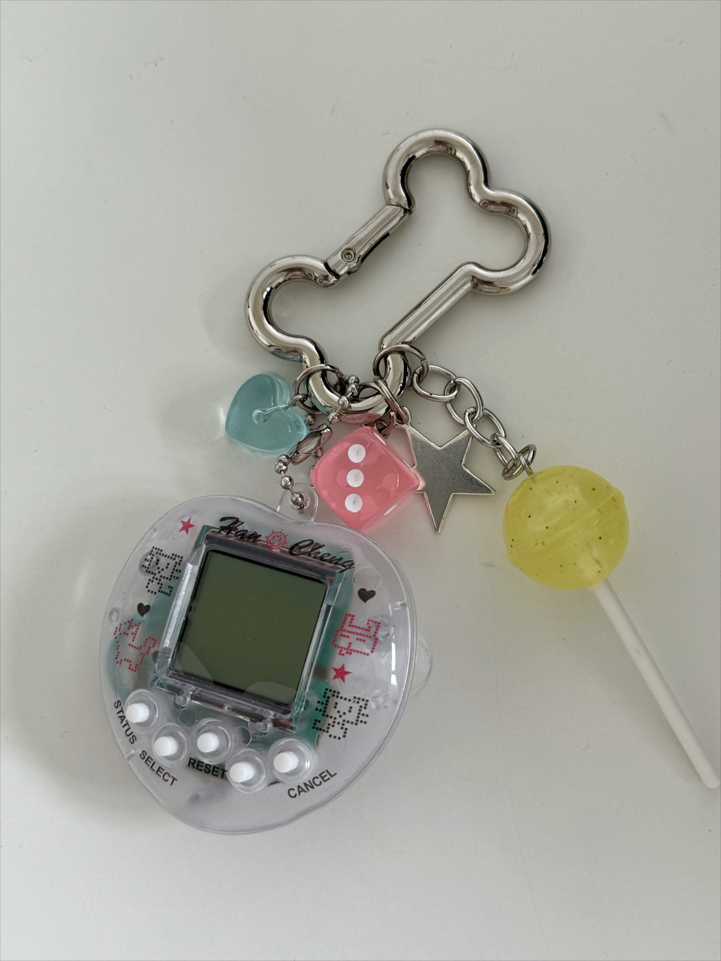 tamagotchi pink and white keychains