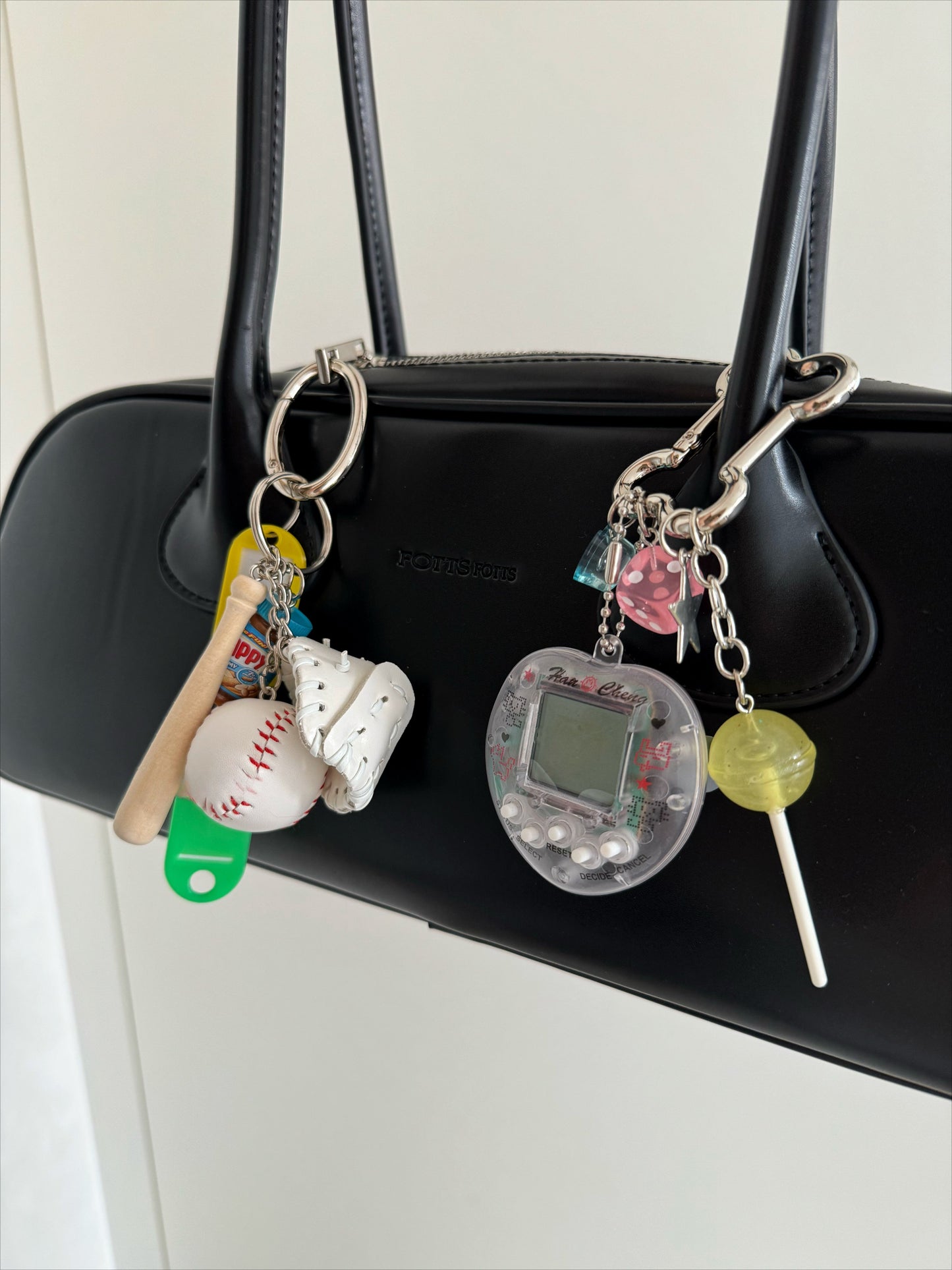tamagotchi pink and white keychains