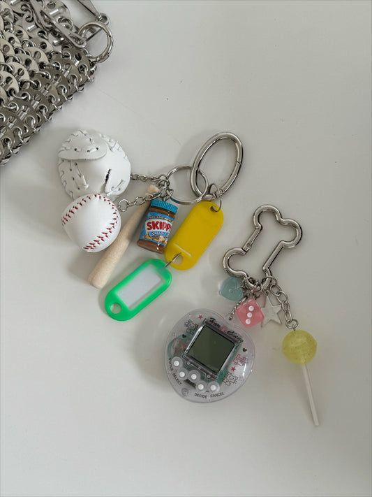 tamagotchi pink and white keychains